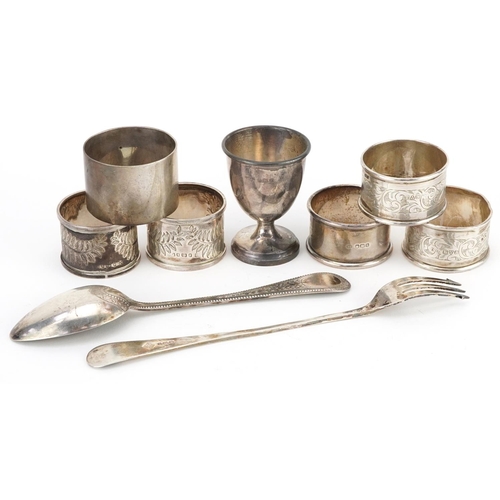 397 - Victorian and later silver comprising six napkin rings, eggcup, pickle fork and tablespoon, the larg... 