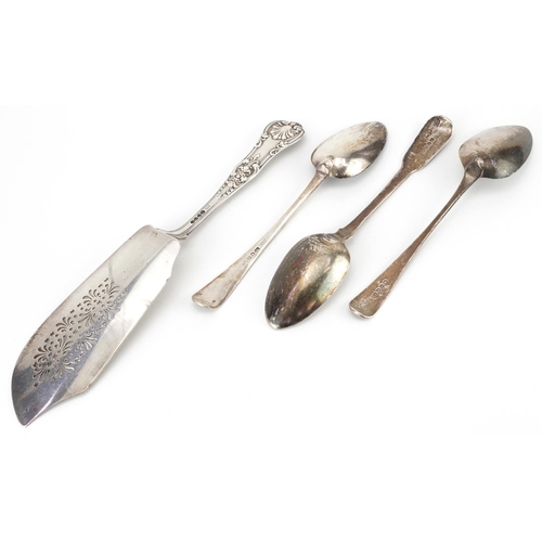 302 - George IV and later silver comprising three Georgian tablespoons and a Victorian fish slice by Willi... 