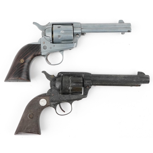 688 - Two decorative model Colt single action army revolvers, one with wooden grip, the largest 25cm in le... 