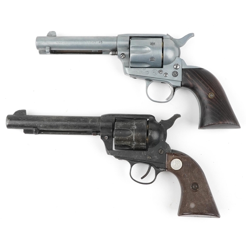 688 - Two decorative model Colt single action army revolvers, one with wooden grip, the largest 25cm in le... 