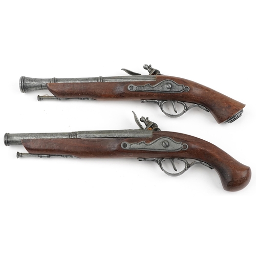 687 - Pair of decorative model percussion pistols, the largest 37cm in length