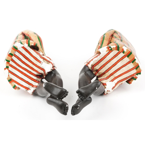 1300 - Pair of hand painted plaster bookends in the form of Blackamoors, each 46cm high