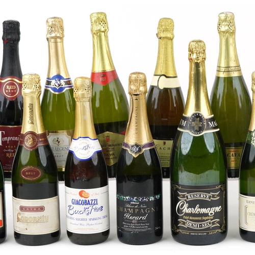 1128 - Twenty bottles of Champagne and sparkling wine including Mumm and Codorniu