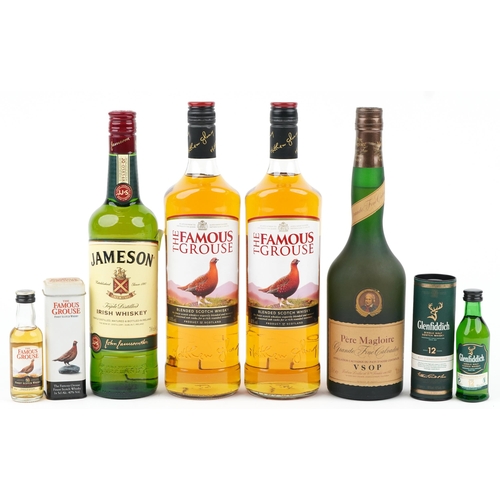 1129 - Bottle of Pere Magloire VSOP Calvados and various whisky including Jamieson and The Famous Grouse