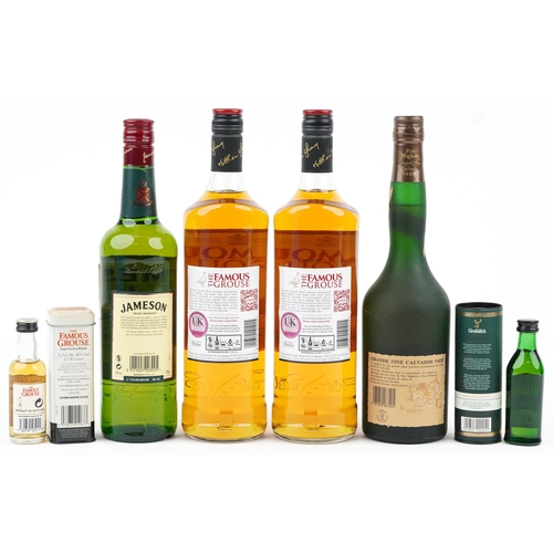 1129 - Bottle of Pere Magloire VSOP Calvados and various whisky including Jamieson and The Famous Grouse