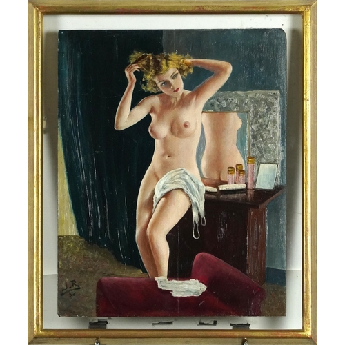 560 - Nude female in a dressing room, 1930s pin-up school oil on wood panel bearing a monogram J R, mounte... 