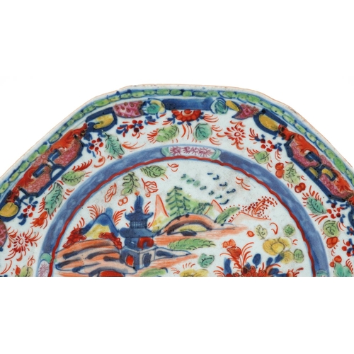 1369 - Chinese porcelain clobbered plate hand painted with a landscape and flowers, 22.5cm in diameter