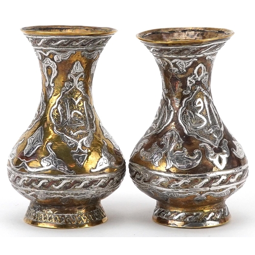 270 - Pair of Islamic brass vases with silver foliate inlay, each 10cm high