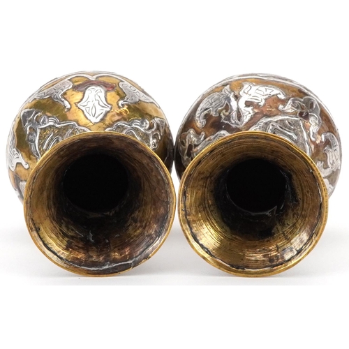 270 - Pair of Islamic brass vases with silver foliate inlay, each 10cm high