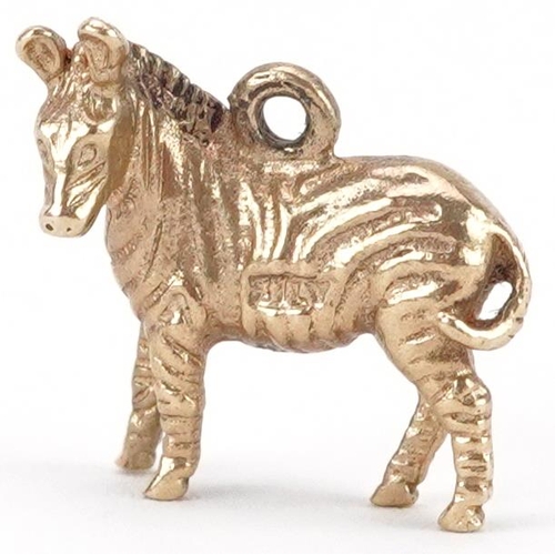 2068 - 9ct gold charm in the form of a zebra, 1.6cm high, 3.0g