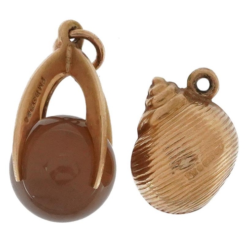 2532 - Two 9ct gold charms comprising an agate sphere and a snail shell, the largest 1.9cm high, total 2.6g