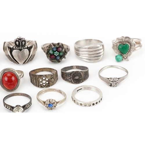 2692 - Seventeen silver rings, some set with semi precious stones including a heavy Claddagh ring and mille... 