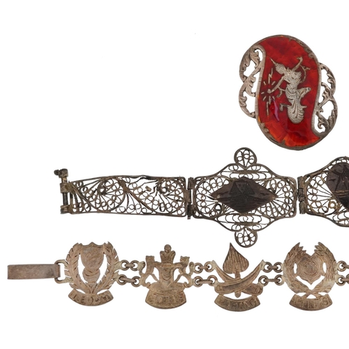 2719 - Silver jewellery including a Malaysian crest bracelet and a Thai Siam silver and enamel pendant broo... 