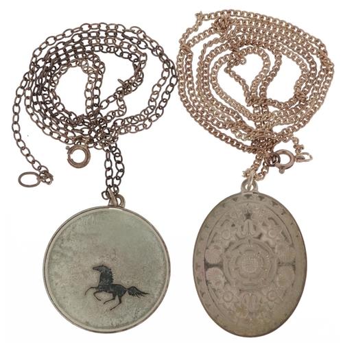 2597 - Two silver medallion pendants on silver necklaces including a 1977 Jubilee Tudor rose, 39.0g