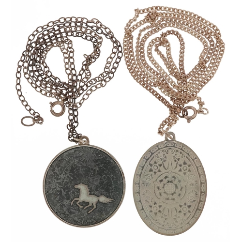 2597 - Two silver medallion pendants on silver necklaces including a 1977 Jubilee Tudor rose, 39.0g