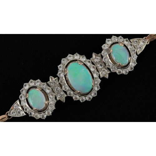 2143 - Victorian style unmarked gold cabochon opal and white sapphire bracelet set with three cabochon opal... 