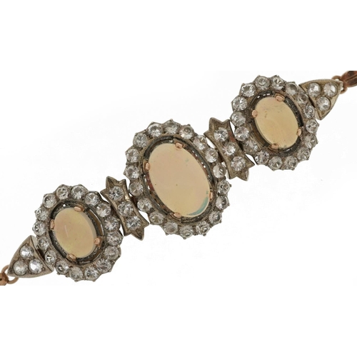 2143 - Victorian style unmarked gold cabochon opal and white sapphire bracelet set with three cabochon opal... 