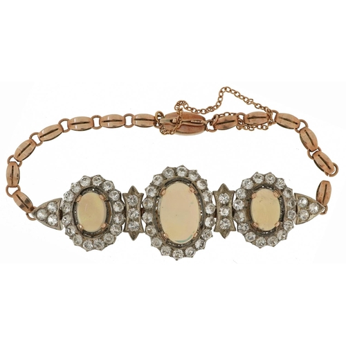 2143 - Victorian style unmarked gold cabochon opal and white sapphire bracelet set with three cabochon opal... 