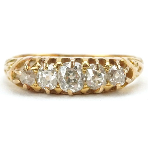 2023 - 18ct gold graduated diamond five stone ring with engraved scrolled shoulders, the largest diamond ap... 