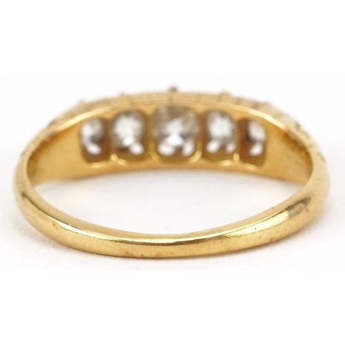 2023 - 18ct gold graduated diamond five stone ring with engraved scrolled shoulders, the largest diamond ap... 