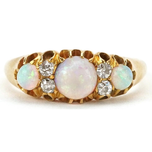 2145 - 18ct gold cabochon opal and diamond seven stone ring, the largest opal approximately 5.50mm in diame... 