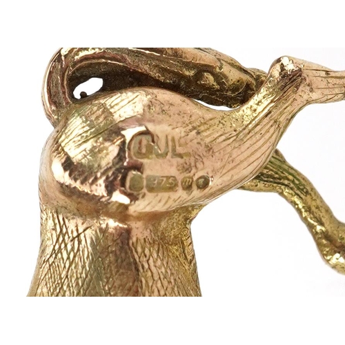 2110 - 9ct gold charm in the form of a standing horse, 2.4cm in length, 7.8g