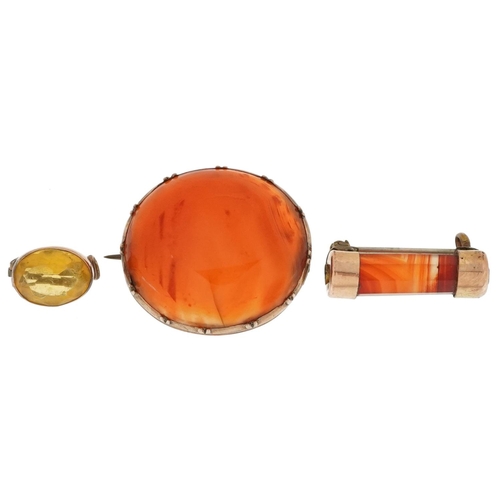 2627 - Three antique brooches comprising two carnelian with gilt metal mounts and a citrine with unmarked g... 