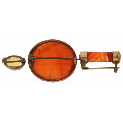 2627 - Three antique brooches comprising two carnelian with gilt metal mounts and a citrine with unmarked g... 