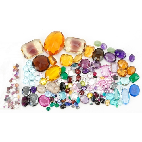 2190 - Loose gemstones and intaglios including blue topaz, citrine, amethyst, garnet and sapphires, the lar... 