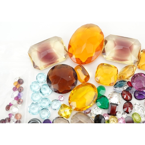 2190 - Loose gemstones and intaglios including blue topaz, citrine, amethyst, garnet and sapphires, the lar... 