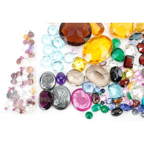 2190 - Loose gemstones and intaglios including blue topaz, citrine, amethyst, garnet and sapphires, the lar... 