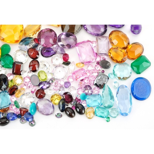 2190 - Loose gemstones and intaglios including blue topaz, citrine, amethyst, garnet and sapphires, the lar... 