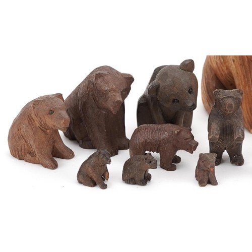 362 - Fourteen German Black Forest carved wood bears and a squirrel, the largest 8cm high