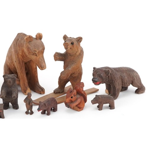 362 - Fourteen German Black Forest carved wood bears and a squirrel, the largest 8cm high