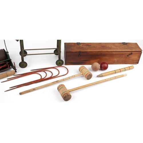 1615 - Vintage toys comprising Tri-ang croquet set with box, Tri-ang mangle and Webb miniature lawnmower fo... 