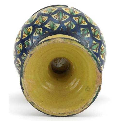 1347 - Islamic pottery vase hand painted with stylised floral motifs, 22cm high