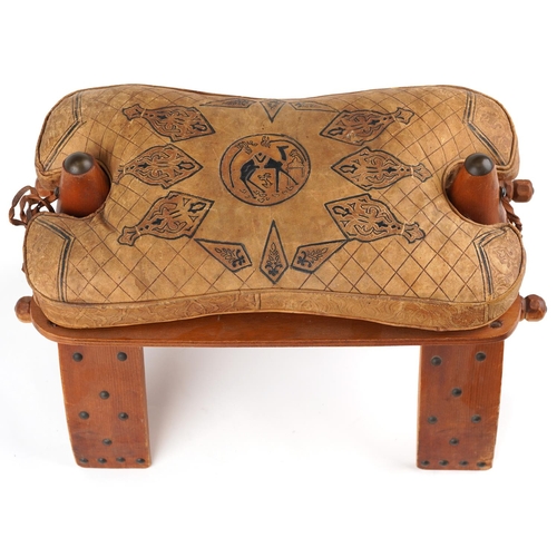 1045 - Vintage hardwood camel stool with leather upholstered cushion tooled with foliate motifs and a camel... 