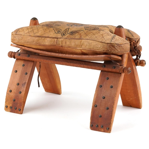 1045 - Vintage hardwood camel stool with leather upholstered cushion tooled with foliate motifs and a camel... 