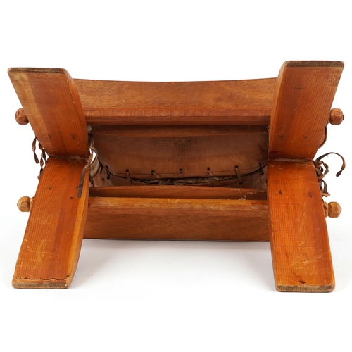 1045 - Vintage hardwood camel stool with leather upholstered cushion tooled with foliate motifs and a camel... 