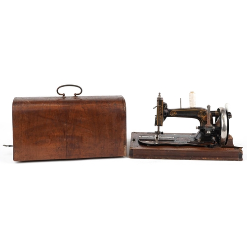 183 - Victorian cast iron sewing machine with case, the sewing machine numbered 2004356, the case 40.5cm w... 