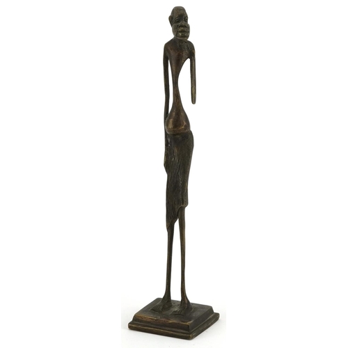 1321 - African patinated bronze figure of a tribesman, 30cm high