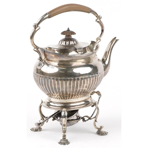 101 - Goldsmiths & Silversmiths Co Ltd, Victorian silver teapot on stand with burner, the teapot with wood... 