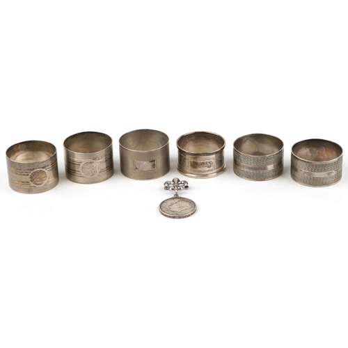 300 - Six George V and later silver napkin rings including two pairs and a 1967 United States of America h... 