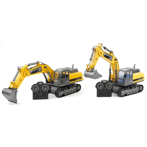 1593 - Two Hobby Engine remote controlled excavator cranes with remotes, each approximately 60cm in length