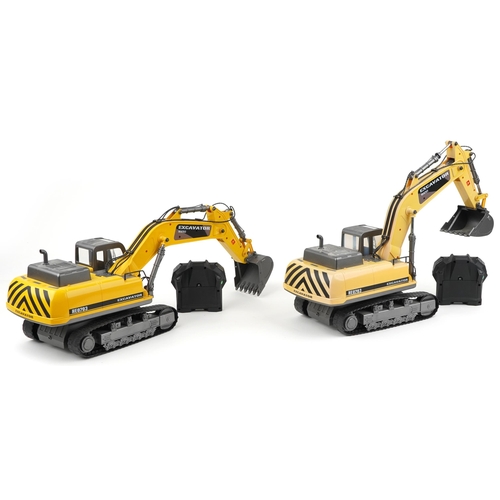 1593 - Two Hobby Engine remote controlled excavator cranes with remotes, each approximately 60cm in length