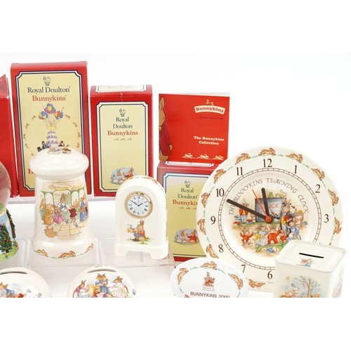 1174 - Royal Doulton Bunnykins collectable table and nursery ware including porcelain moneybox, wall clock,... 