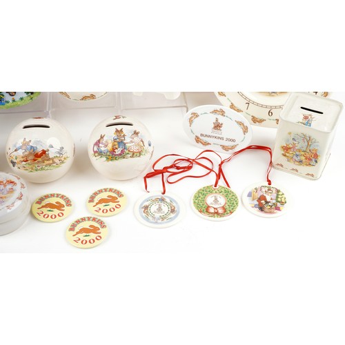 1174 - Royal Doulton Bunnykins collectable table and nursery ware including porcelain moneybox, wall clock,... 