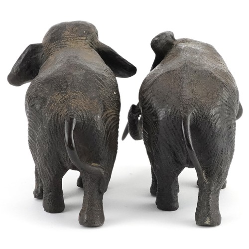24 - Two Japanese patinated bronze elephants, Meiji period, each with character marks to the feet, the la... 