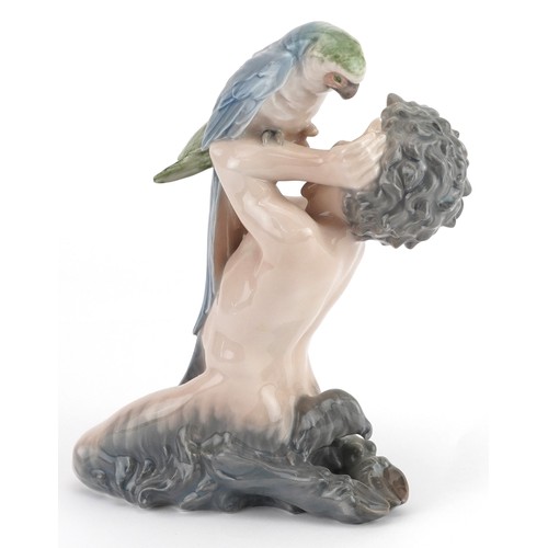 1147 - Royal Copenhagen, Danish porcelain model of a faun with parrot, numbered 752, 18.5cm high