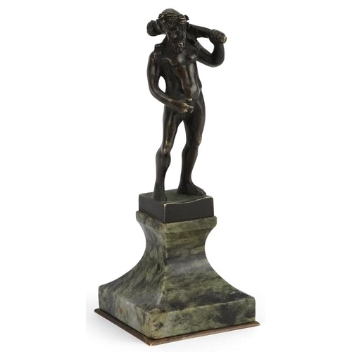 182 - Antique patinated bronze statue of drunken Hercules raised on a square green marble base, 13.5cm hig... 